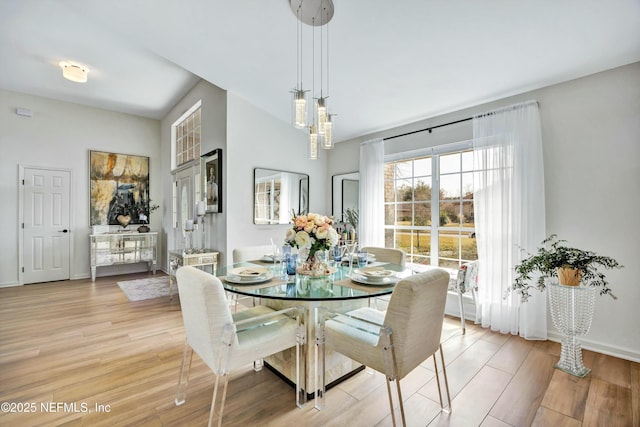 dining area featuring light wood-type flooring