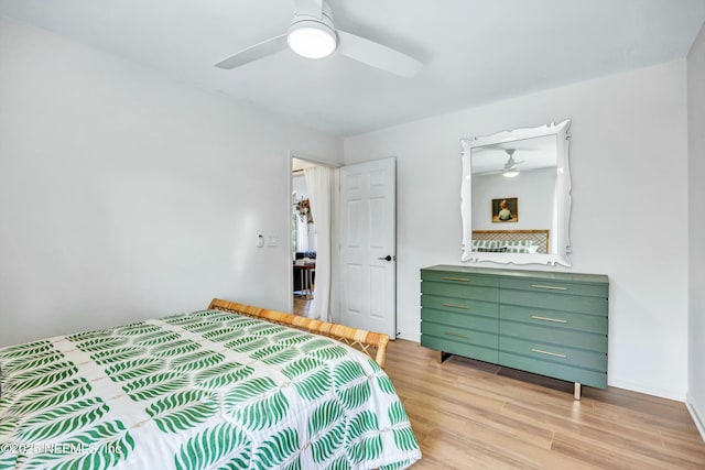 bedroom with ceiling fan and light hardwood / wood-style flooring