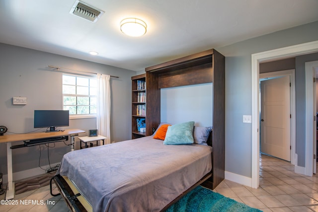 bedroom featuring light tile patterned floors