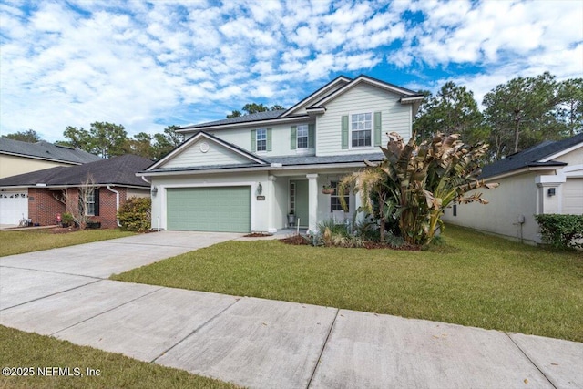 view of front of property featuring a garage and a front yard