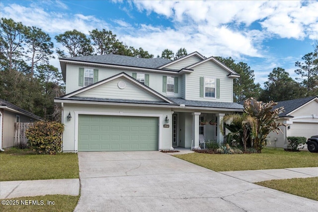 view of front facade featuring a garage and a front yard