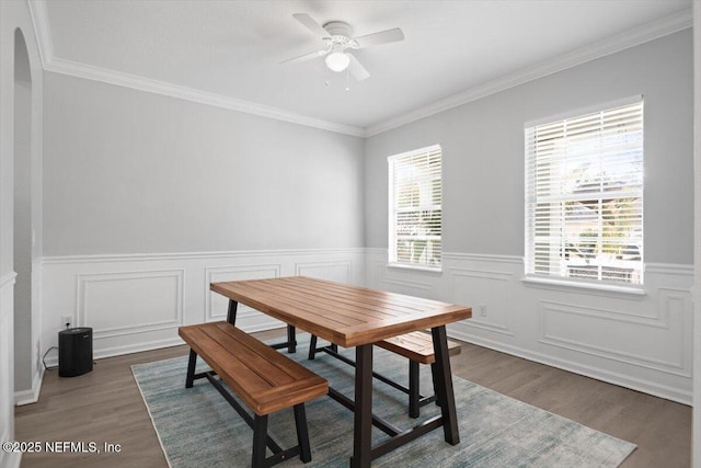 dining room featuring ceiling fan, crown molding, and dark hardwood / wood-style flooring