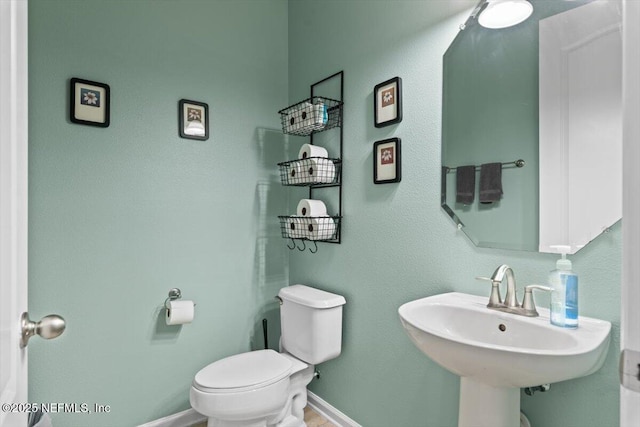 bathroom with toilet and sink