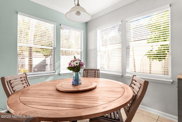 tiled dining room with ornamental molding