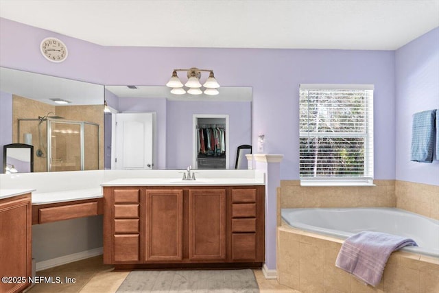 bathroom featuring vanity and plus walk in shower