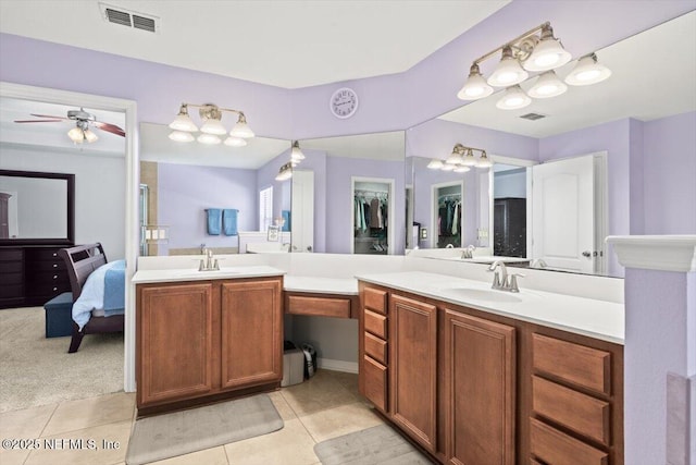 bathroom featuring vanity, tile patterned floors, and ceiling fan