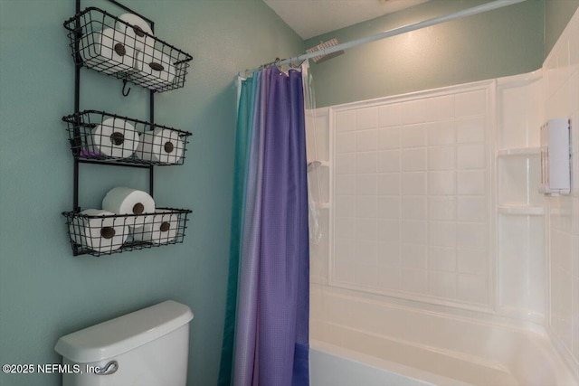 bathroom featuring toilet and shower / bath combo with shower curtain