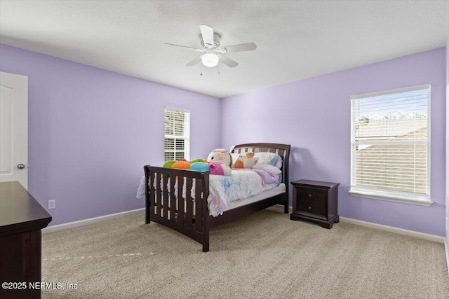 bedroom with light colored carpet and ceiling fan