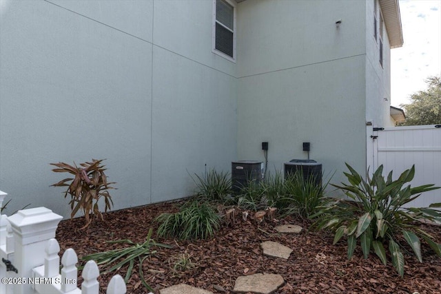 view of side of home with cooling unit