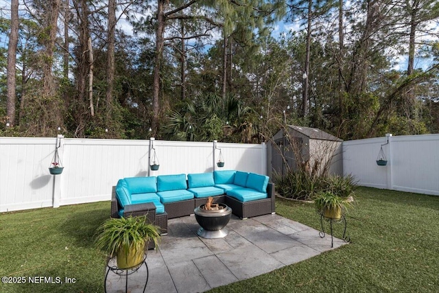 view of patio / terrace featuring outdoor lounge area and a storage unit