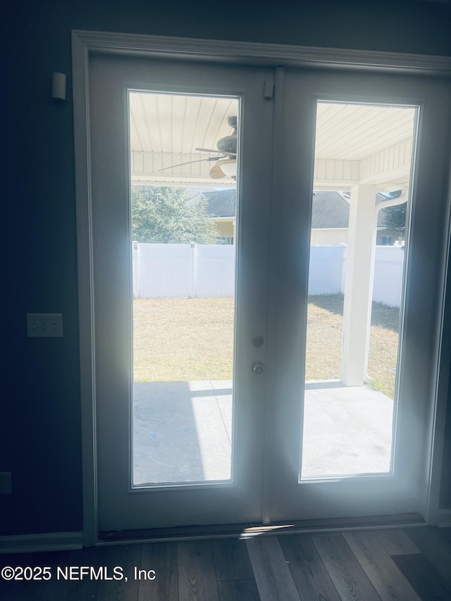 doorway with wood-type flooring and french doors