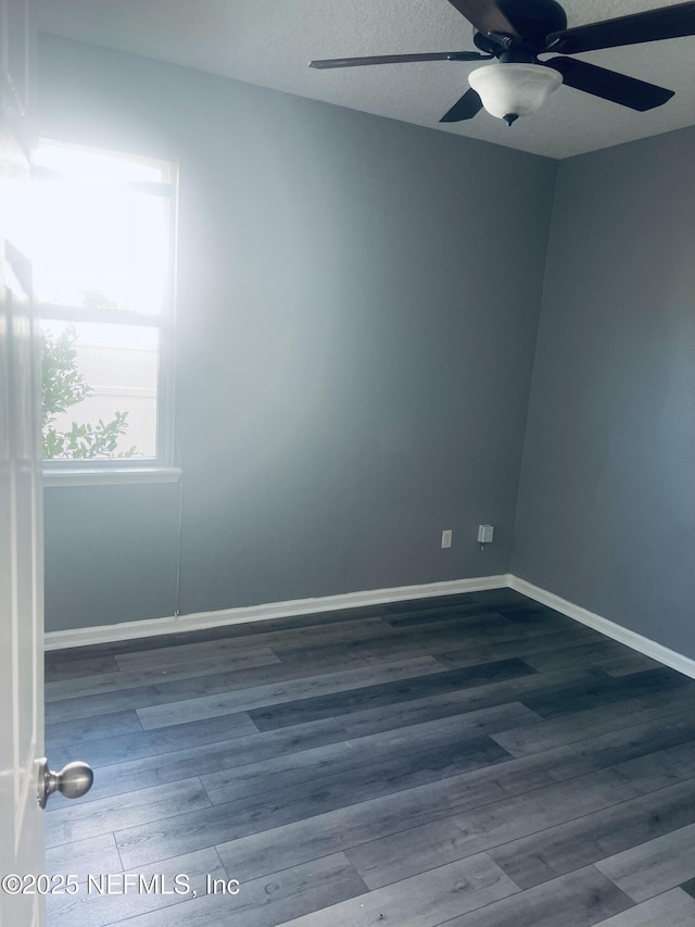 spare room featuring ceiling fan, hardwood / wood-style floors, and a textured ceiling