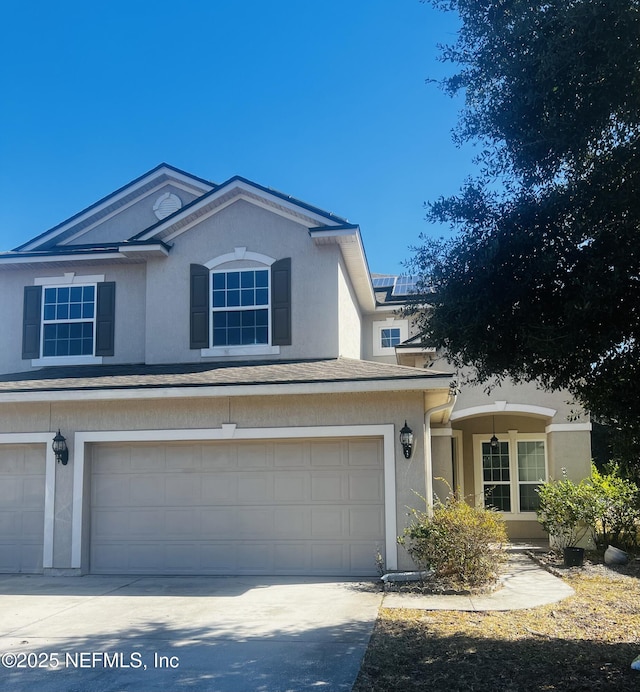 front of property with a garage