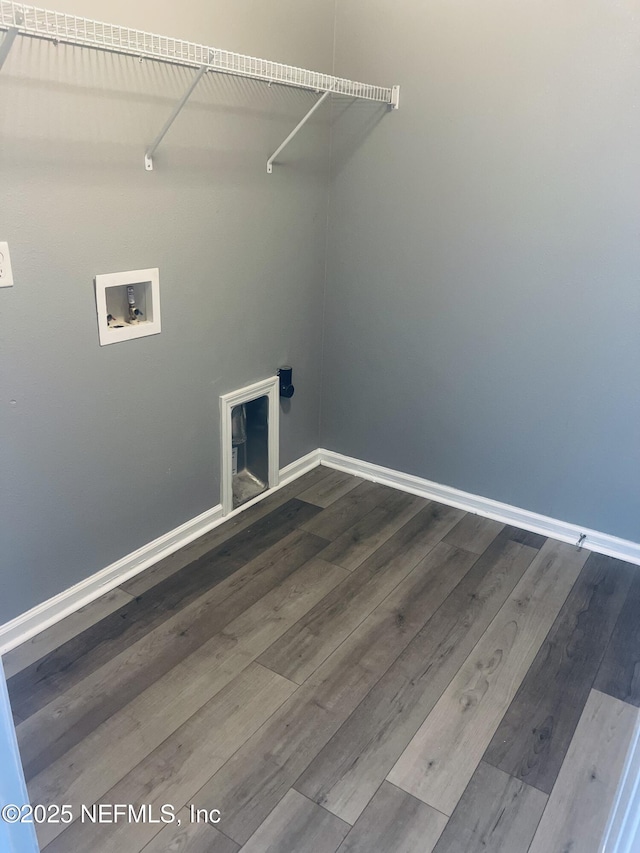 washroom featuring hookup for a washing machine and hardwood / wood-style floors