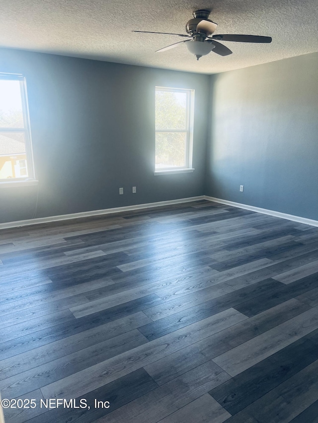 unfurnished room featuring ceiling fan, dark hardwood / wood-style floors, and a textured ceiling