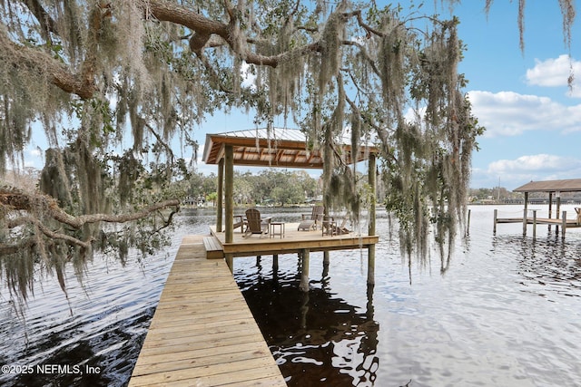 view of dock with a water view