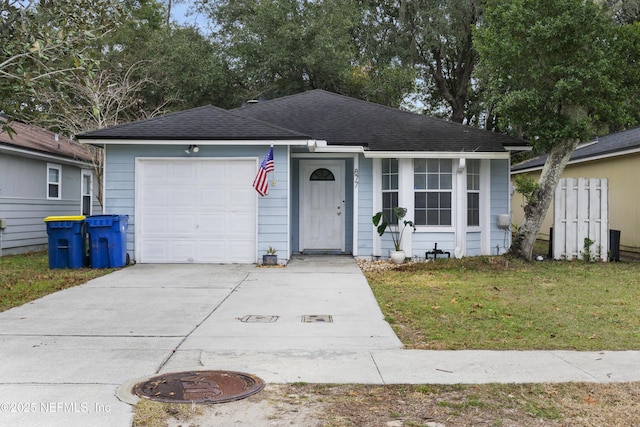 single story home with a garage and a front yard