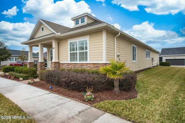 view of property exterior with covered porch and a lawn