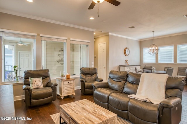 living room with crown molding, ceiling fan with notable chandelier, and dark hardwood / wood-style flooring