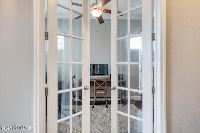 interior space featuring ceiling fan and french doors