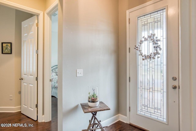 foyer entrance with dark hardwood / wood-style floors