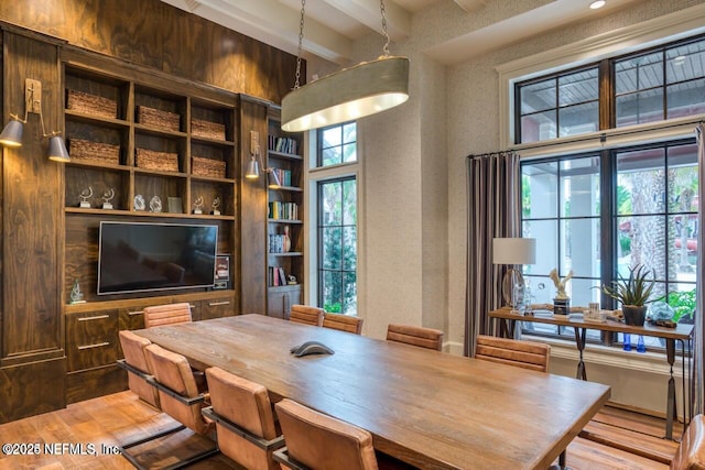 office space with plenty of natural light and beamed ceiling