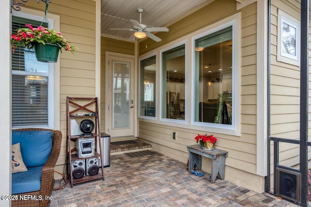 view of patio featuring ceiling fan