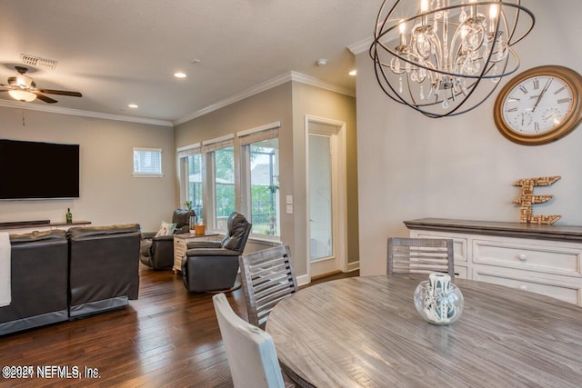 dining area with dark wood-type flooring, crown molding, and ceiling fan with notable chandelier