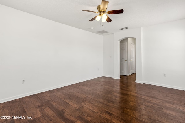 spare room featuring a textured ceiling, dark hardwood / wood-style floors, and ceiling fan