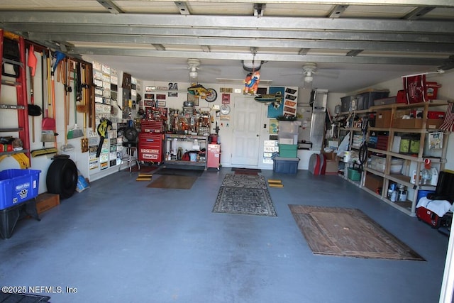 garage featuring ceiling fan and a workshop area