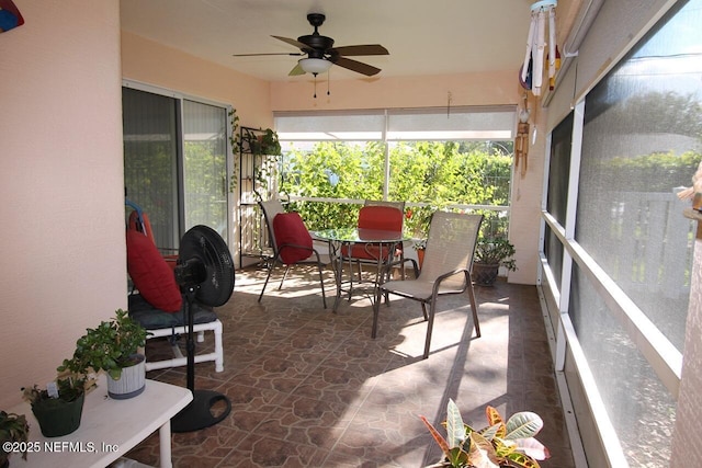 sunroom featuring a wealth of natural light and ceiling fan