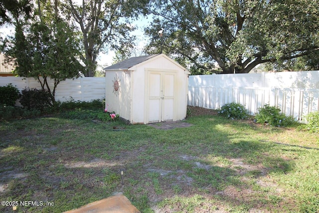 view of outbuilding with a yard