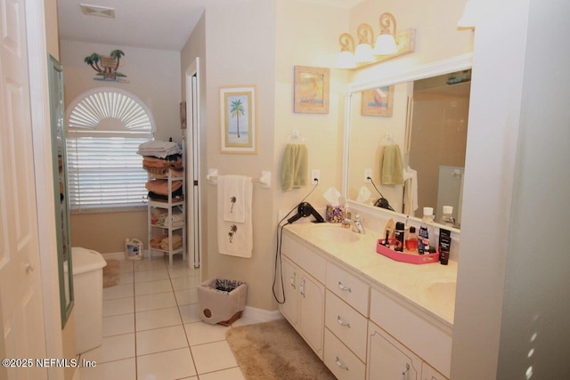 bathroom featuring tile patterned flooring and vanity