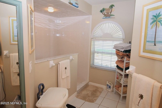 bathroom with a shower and tile patterned floors