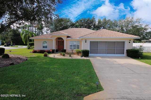 mediterranean / spanish-style house with a garage and a front lawn