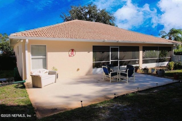 rear view of property with a patio area