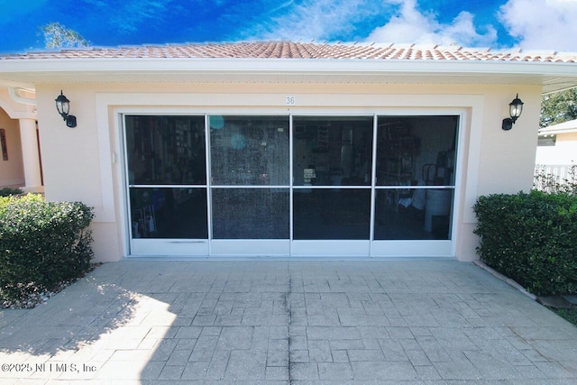 rear view of property featuring a patio