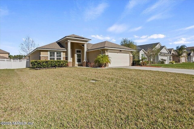 prairie-style home with a garage and a front lawn