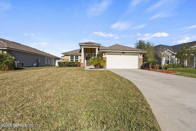 view of front of property featuring a garage and a front yard