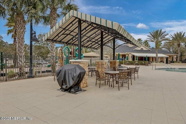 view of patio / terrace with area for grilling and a playground