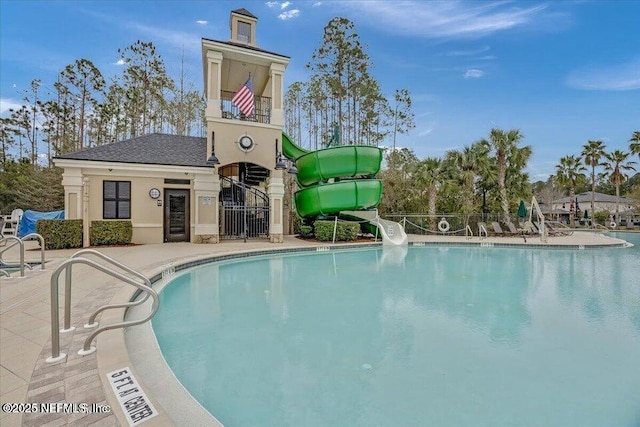 view of pool featuring a patio area and a water slide