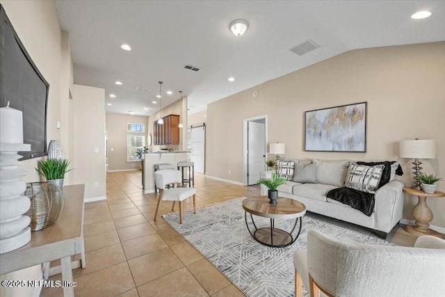 living room featuring light tile patterned flooring and lofted ceiling