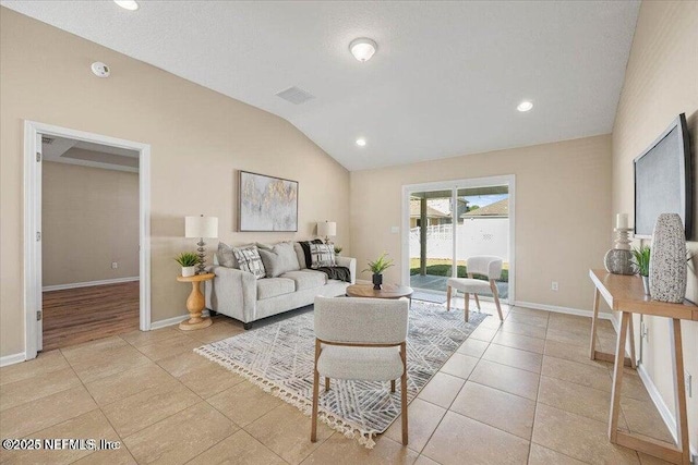 tiled living room with lofted ceiling