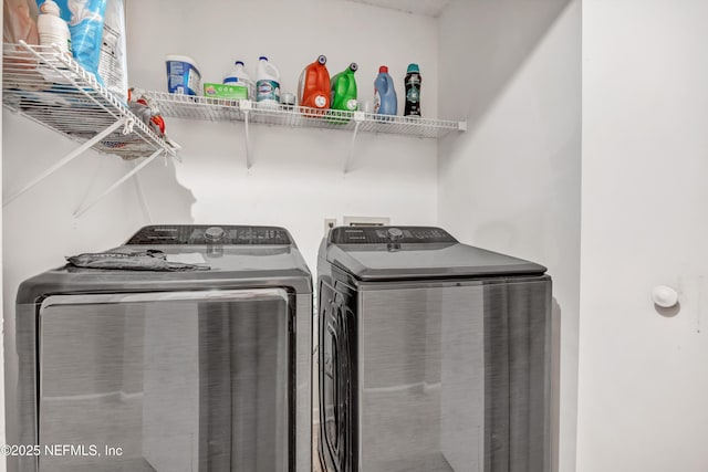 clothes washing area featuring washing machine and dryer