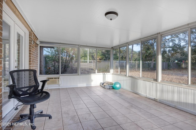 unfurnished sunroom with a wall mounted AC