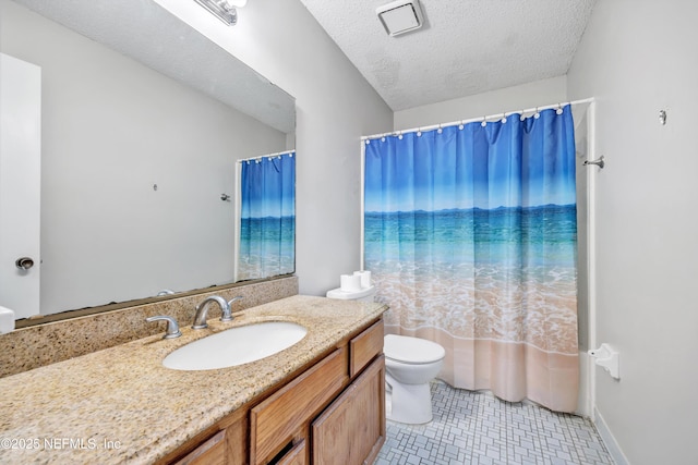 full bathroom with tile patterned flooring, vanity, shower / tub combo, toilet, and a textured ceiling