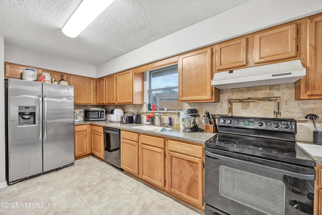 kitchen featuring a textured ceiling, sink, decorative backsplash, and black appliances