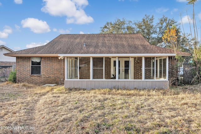 back of house featuring a sunroom