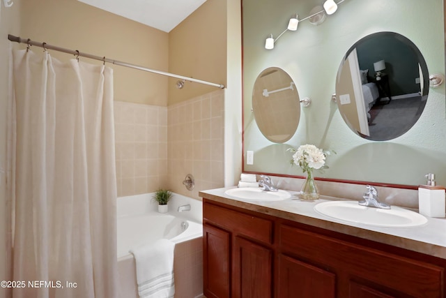 bathroom featuring shower / tub combo with curtain and vanity