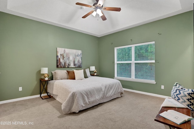 bedroom featuring light carpet and ceiling fan